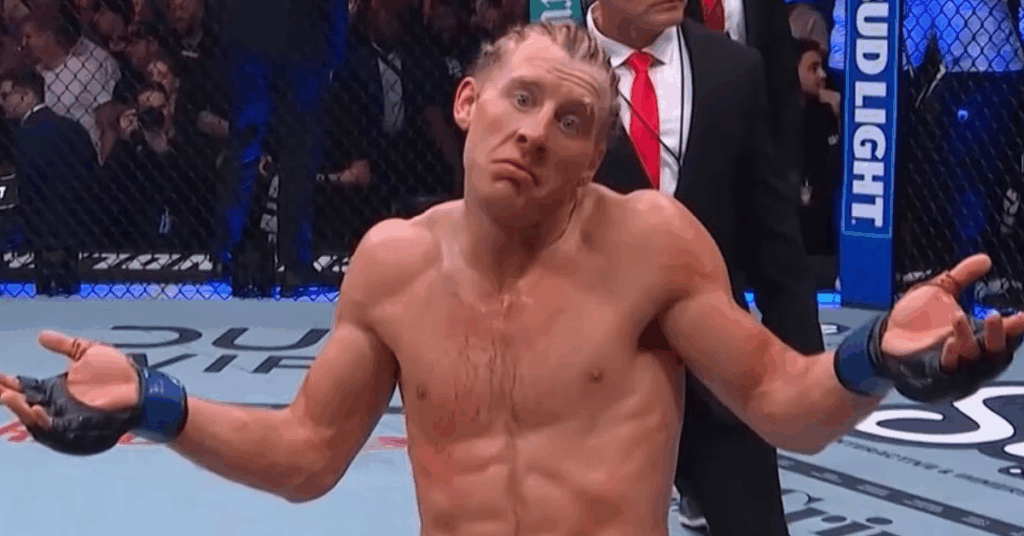 El luchador de la UFC Jack Hermansson se encoge de hombros con una expresión de confusión en el octágono.