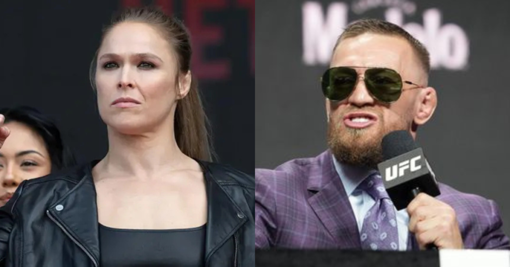 Ronda Rousey seria con chaqueta de cuero y Conor McGregor con gafas de sol y traje hablando en micrófono UFC.