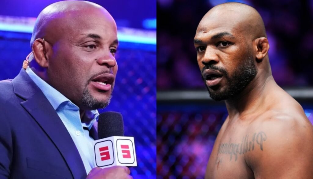 Daniel Cormier (izq), comentarista con micrófono ESPN; Jon Jones (der), luchador, mira fijamente. Rivalidad icónica de MMA.
