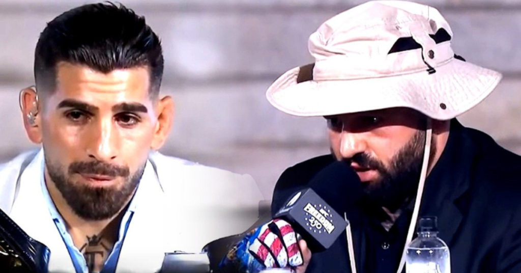 Luchadores de UFC en un evento de prensa. Uno con barba, pendiente y tatuaje, el otro con sombrero de ala ancha y micrófono con guante de bandera.