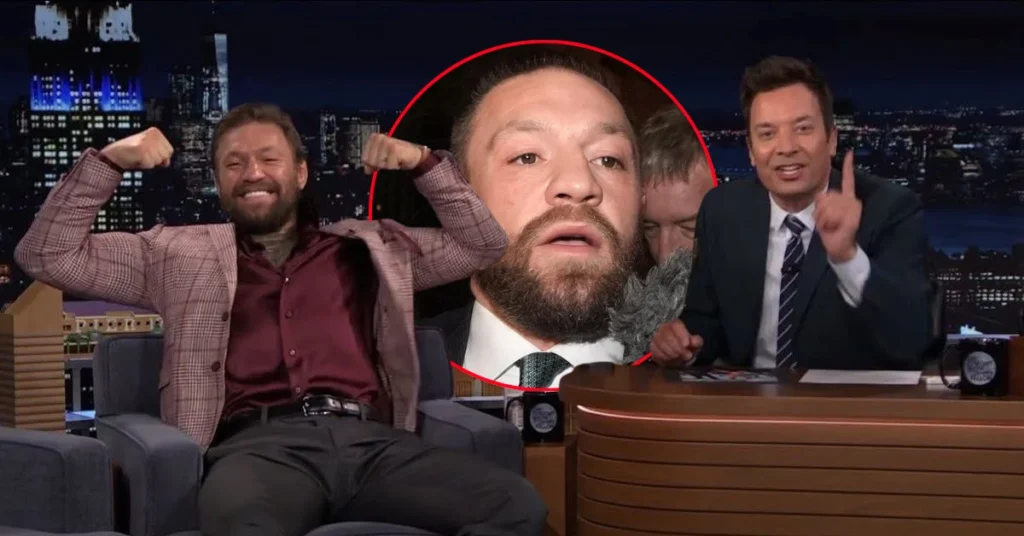 Jimmy Fallon en su talk show. Un sonriente Conor McGregor flexiona bíceps, contrastando con su rostro serio en primer plano (círculo rojo).